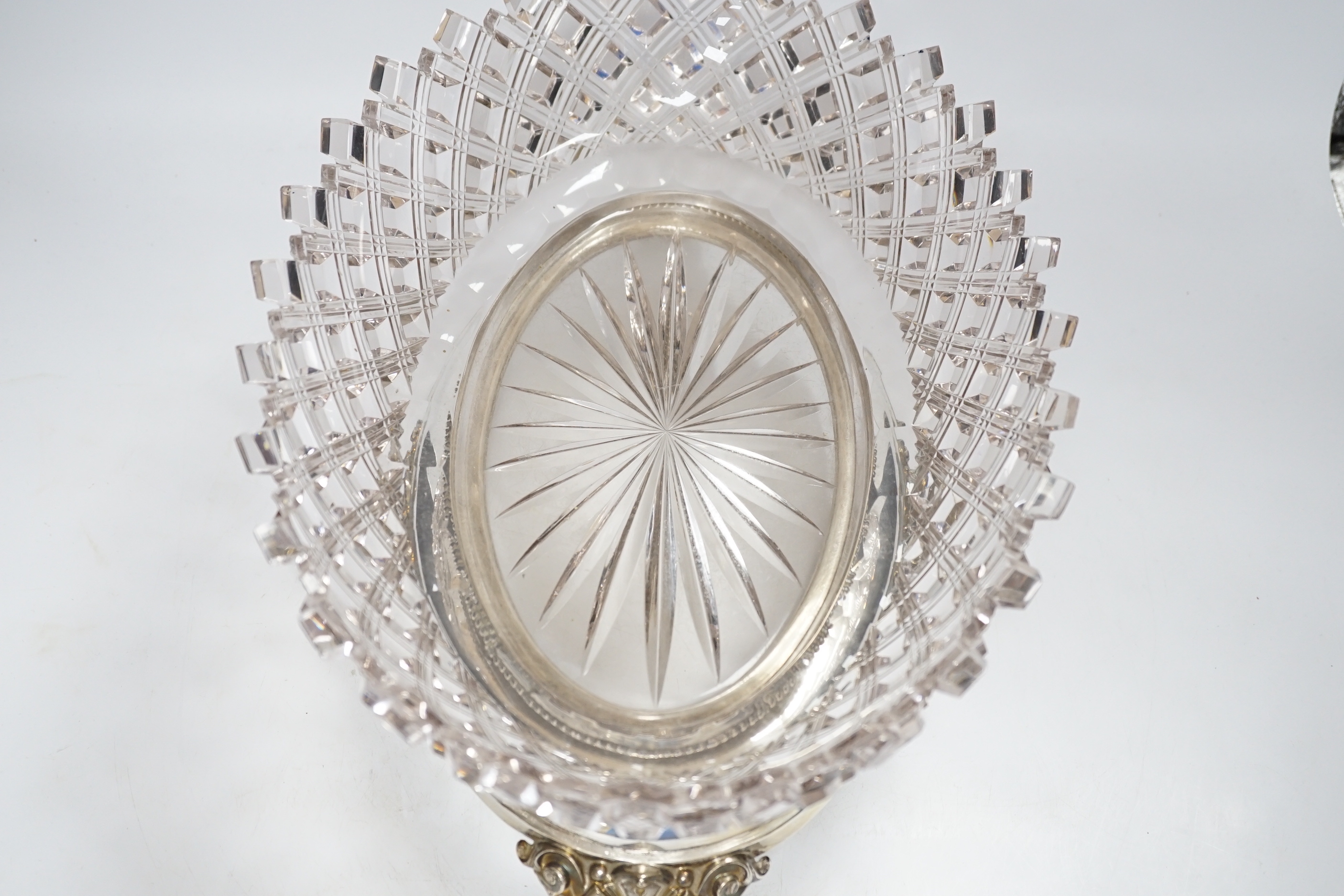 A heavy cut glass centrepiece with Dutch silver base, 39cm